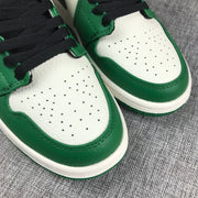 Close-up of the perforated white toe panels and green trim.