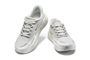 Pair of light grey Nike sneakers shown from the front and top.