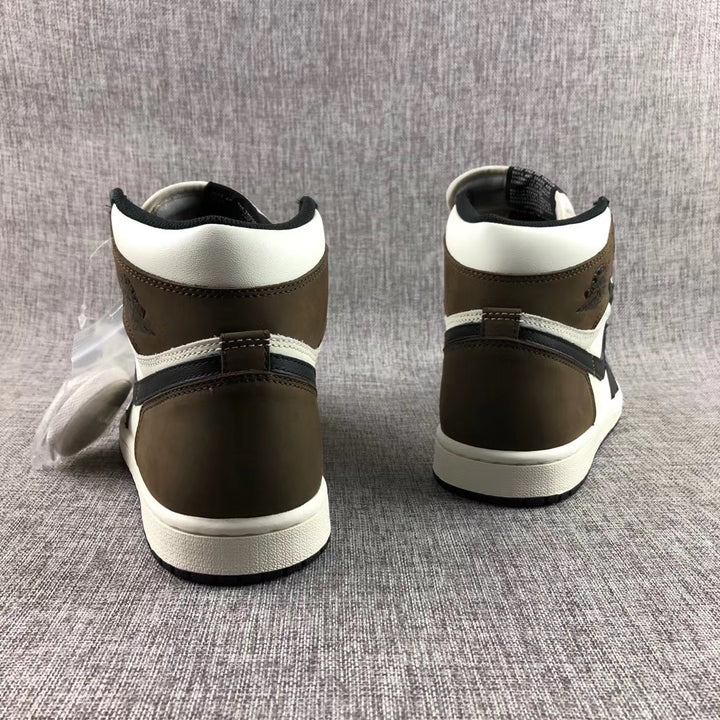Rear view of the high-top sneakers showing brown heel panels, white collars, black details, and white midsoles.