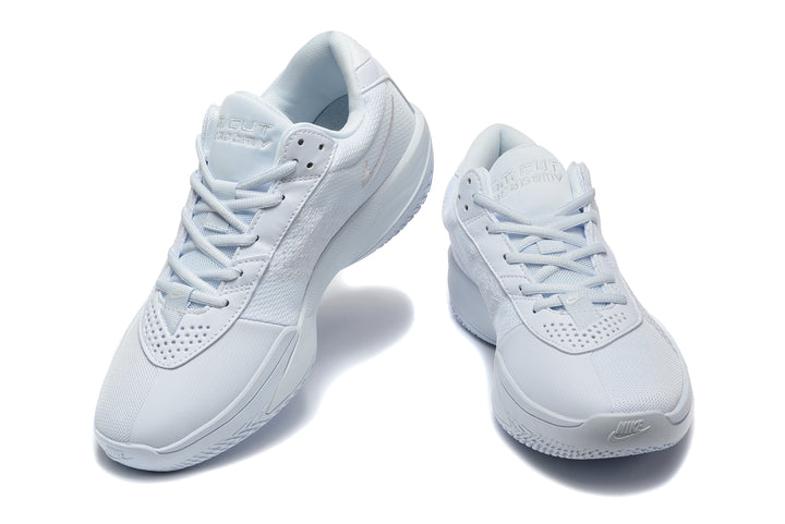 Pair of white Nike LeBron Witness basketball shoes shown from front and three-quarter angles.