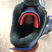 Close-up of the padded collar and tongue with dark green and red lining details.