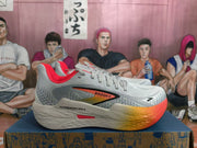 Side view showing Brooks branding and Hyperion Max text on a white and gray shoe with orange-red accents