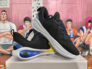 Angled view of black and blue basketball sneakers displaying the lace-up upper, padded collar, and sculpted white sole.