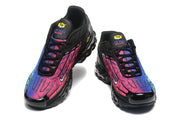 Front views of black Nike Air Max Plus TN sneakers with pink, purple, and blue gradient panels.