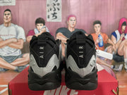 Rear view of black and silver sneakers with AIR lettering