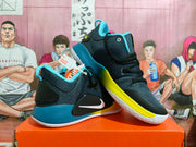 Pair of black and dark gray Nike basketball shoes with blue heel details, yellow accents and white outsoles