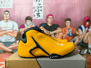 Side view highlighting the sculpted design and yellow upper