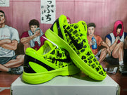 Angled view of paired green and black sneakers showing the patterned upper, black Swoosh, and contrasting heel panels.