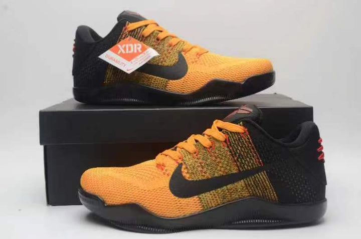 Nike Kobe 11 shoes in orange and black displayed on a shoebox