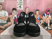 Front view of black and white high-top sneakers with mesh toe panels, black laces, and contrasting lace supports.