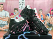 Angled view of black shoes with pink accents and laces, shown together on a box.