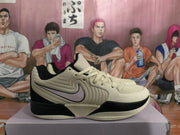 Side profile highlighting the beige and black color blocking, pink swoosh, and visible Air Zoom outsole branding.