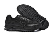 Black Nike Air Max 97 OG sneakers showing the side profile and outsole