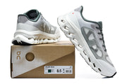 White and gray On sneakers displayed with a Cloudtilt Remix box labeled EU 42, US 8.5, and M