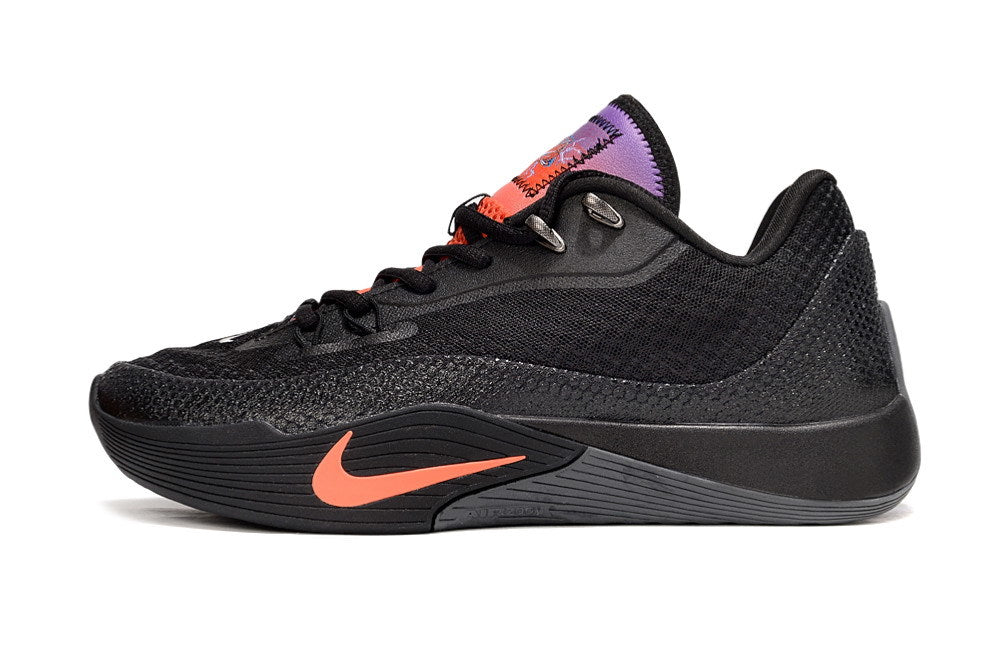 Side view of black Nike S.T. Flare EP sneakers with orange accents and a purple-orange tongue.