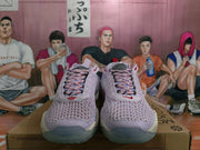 Front view of lavender Nike basketball sneakers with patterned laces, red accents and textured knit-style uppers.
