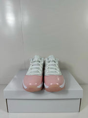 Front view of the pair showing white laces, white mesh uppers, and pink toe overlays.