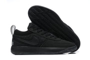 All-black low-top Nike Book 1 shoe with textured side panels and heel pull loop
