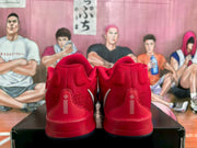 Rear view of the red Nike basketball sneakers showing padded heels and white vertical detailing.