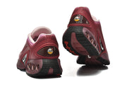 Rear and outsole views of pink gradient Nike Air Max DN sneakers.