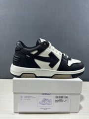 Side view of black-and-white Off-White Out Of Office sneakers displayed on a shoebox; the box label shows sample size EU 42 and style code OMAI89C99LEA0070110.
