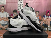 Angled product view showing both sneakers, white padded uppers, black glossy overlays, pull tabs, and the layered sole design.