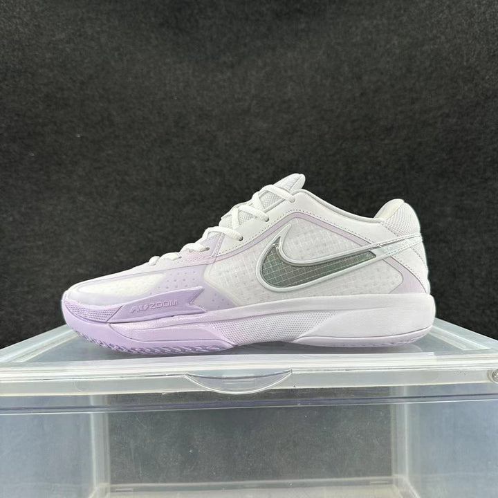Side view of a white Nike Air Zoom sneaker with light purple accents and a contrasting Swoosh