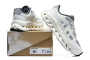 On Cloudtilt Remix sneakers beside a box label showing sample size US 7, UK 6, EU 40, and JP 24