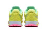 Rear view of the yellow shoes showing mint-green collars, textured heel panels, and pink outsole sections.