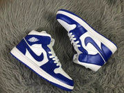 Overhead angled view showing both sneakers, blue side Swooshes, white midsoles, and blue outsoles.