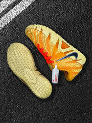 Yellow Nike sneaker and detached pale yellow outsole shown from above.
