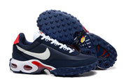 Nike Air Max Waffle SP sneakers shown from the side and underneath, highlighting the lugged navy outsole.