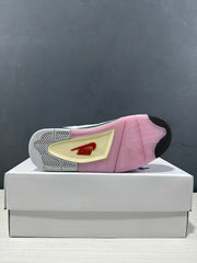 Outsole view showing pink and black traction sections with a contrasting central panel.
