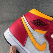 Close-up of the textured side panel, yellow swoosh and winged collar branding.