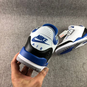 Rear view showing the blue and white heel branding area, black heel overlays, and gray outsole edges.