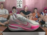 Side profile highlighting the textured upper, Nike Swoosh, layered midsole, and pink toe accent.
