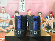 Rear view of black Jordan high-top sneakers showing Jordan heel tabs and the number 23.
