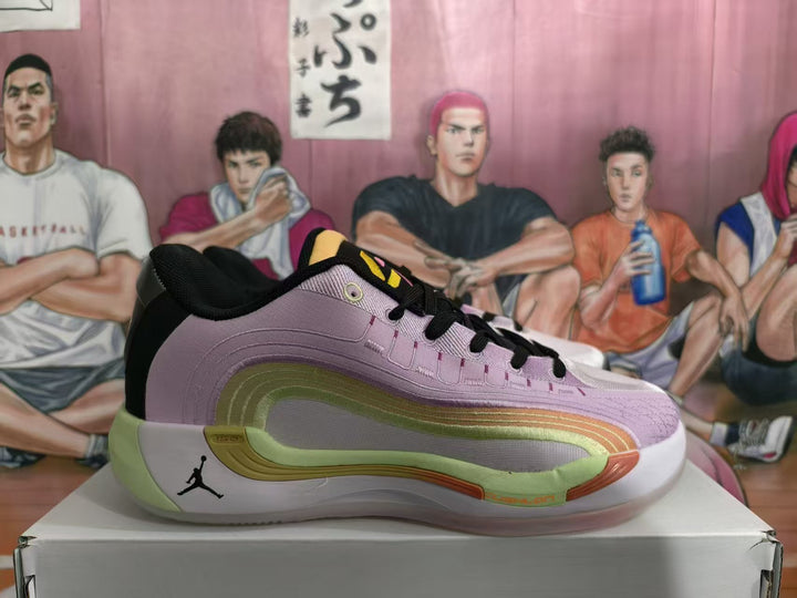Side view of a lavender-pink Jordan sneaker with black laces, green sole accents, and a visible Jumpman logo on a box.