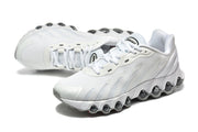 White Nike Air Max DN sneaker pair in a side and top view, highlighting the sculpted side panels and rounded sole pods.