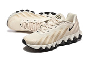 Pair of cream Nike Air Max DN sneakers shown from angled top views