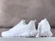 Rear and side views of white Alo sneakers with heel pull tabs.