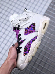Side view highlighting the purple patterned panels and translucent outsole details.