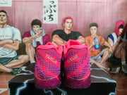 Rear view of the sneakers showing pink-and-purple heel panels with visible “TRUELUE” lettering.