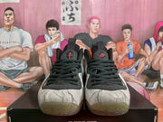 Front view of the sneakers with black laces, padded tongues, patterned toe boxes, and translucent toe outsoles.
