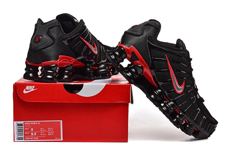 Black and red Nike Shox TL sneakers displayed with a red Nike shoe box; label shows size US Men 8, US Women 9.5 and style code CN0151 003.