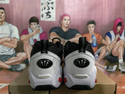 Rear view of the sneakers showing white heel panels, black pull tabs, and red sole details.
