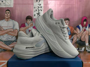 White Brooks running shoes shown from the side, with lace-up closure, perforated-looking uppers and sculpted midsoles.