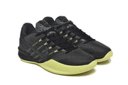 Three-quarter view of the pair, showing black uppers, side Swooshes, and bright volt sole details.