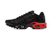 Side profile of a black Nike Air Max Plus sneaker with red accents and visible cushioning units.