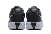 Rear view of the dark grey Nike basketball shoes with perforated heel panels and light blue outsole edges.